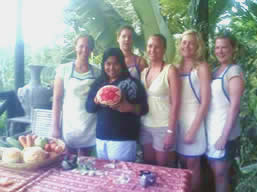 Girls carving fruit